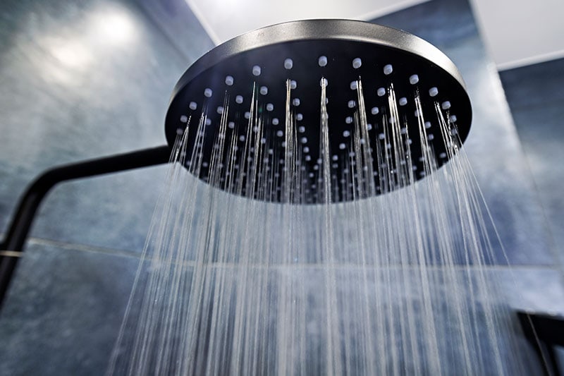 shower with hot water flowing.
