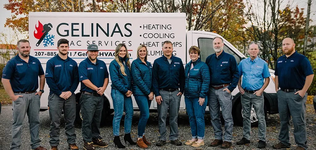 Gelinas HVAC Services' administration team in front of service vehicle at Scarborough office.